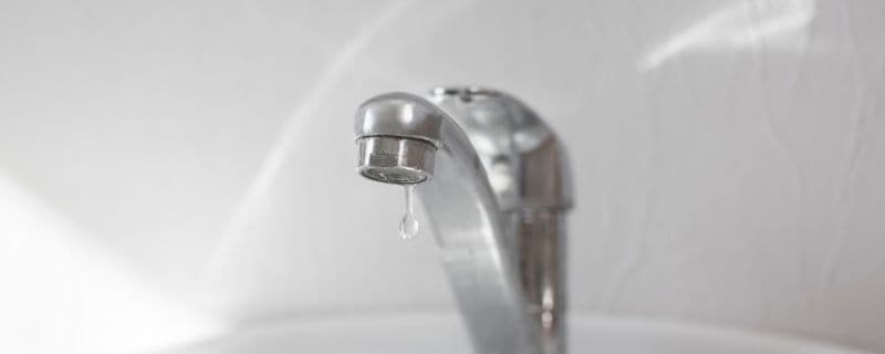 Scale buildup on faucet from hard water in Santa Clarita home